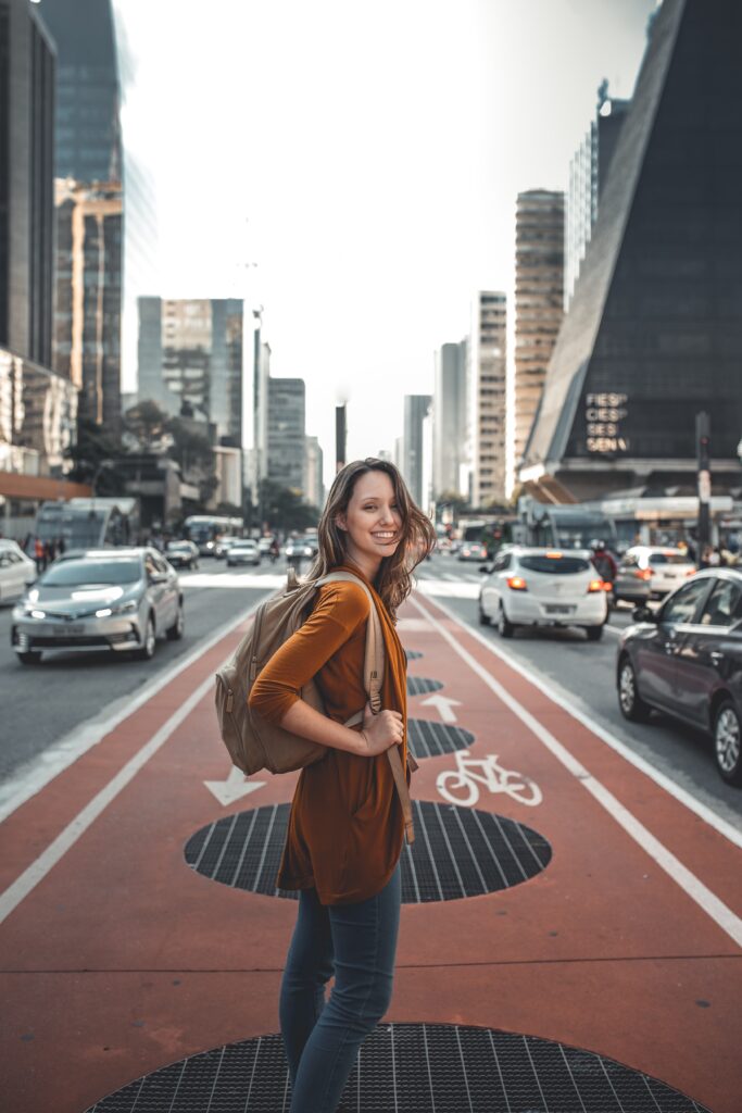 Friendly lady in the middle of the road by Guilherme Stecanella by Unsplash