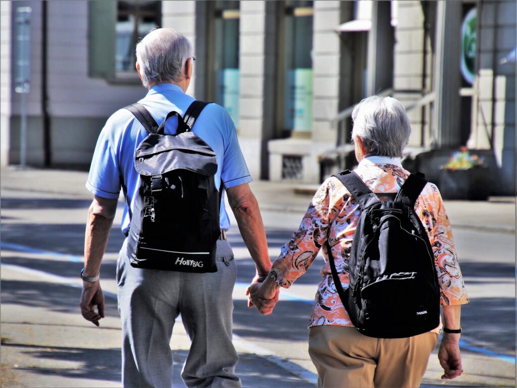 A pair of seniors walking through a city by pasja1000 from Pixabay