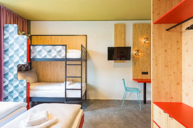 A loft bed inside a MEININGER Hotel Zurich Greencity room