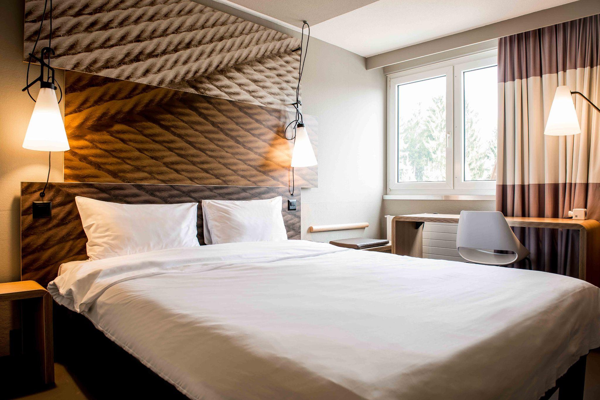 A spacious room with modern design at Ibis Zurich Adliswil
