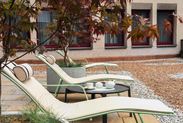 Lounge chairs at Sorell Hotel St.Peter courtyard.